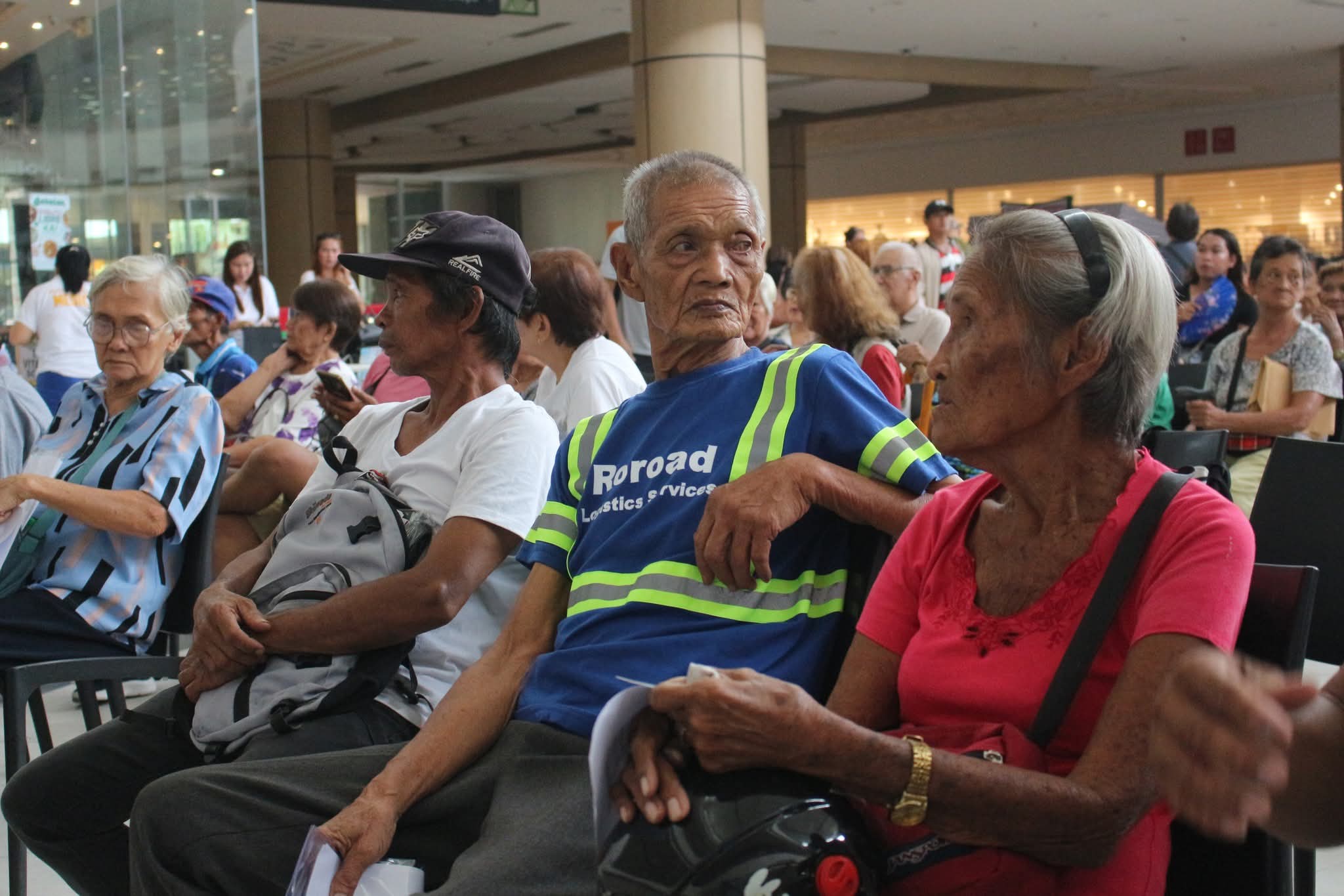 Senior citizens wait for the distribution of cash gifts under the Expanded Centenarians Act during the NCSC service caravan in Naga City. (NFrilles-PIA 5/CamSur)