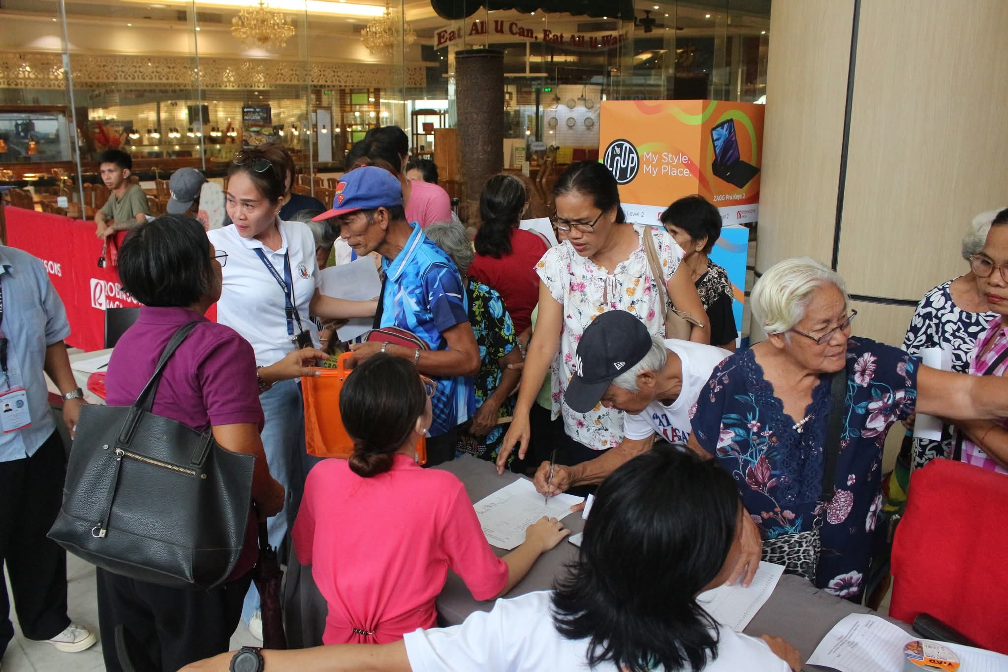 Naga City senior citizens register for the National Commission of Senior Citizens (NCSC) integrated service caravan, gaining access to cash gifts and essential government services. (NFrilles-PIA 5/Camarines Sur)