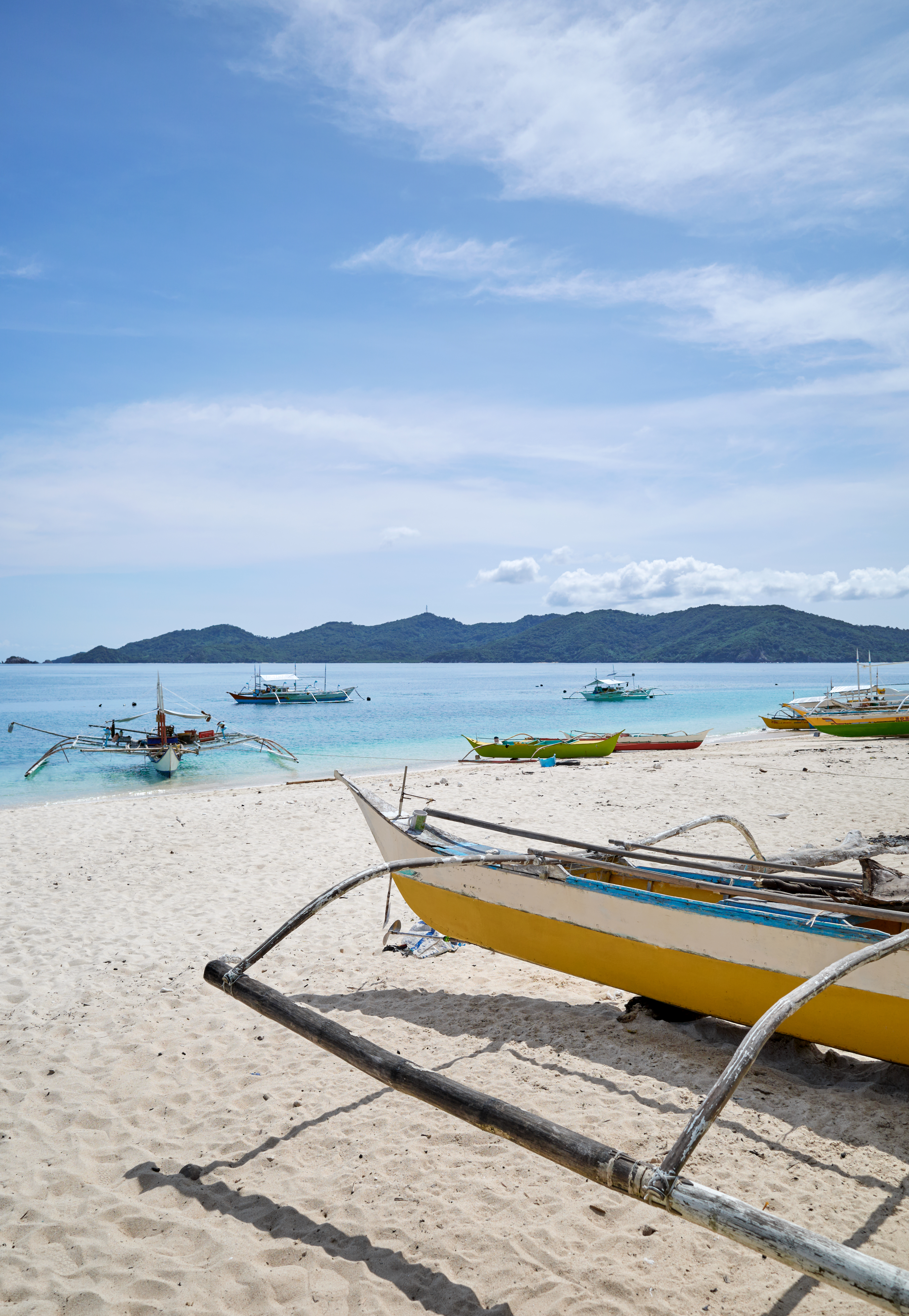 Bangka fishing boats on the beach of Inapupan Island in the Philippines.