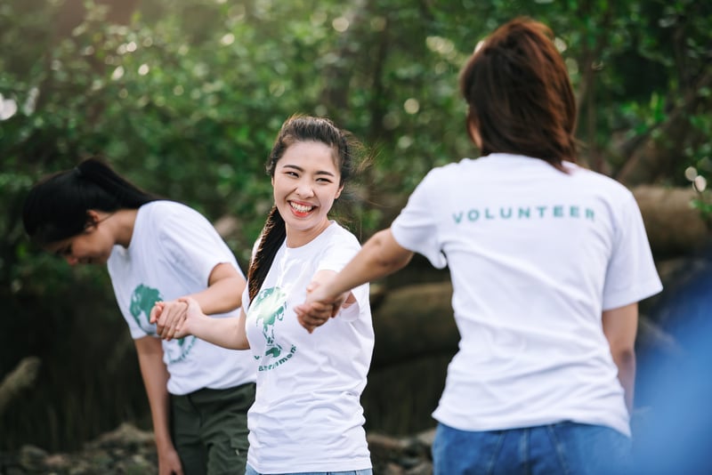 Volunteer teamwork ,volunteering spirit help to clean park area in environment conservation.PlatooFotography