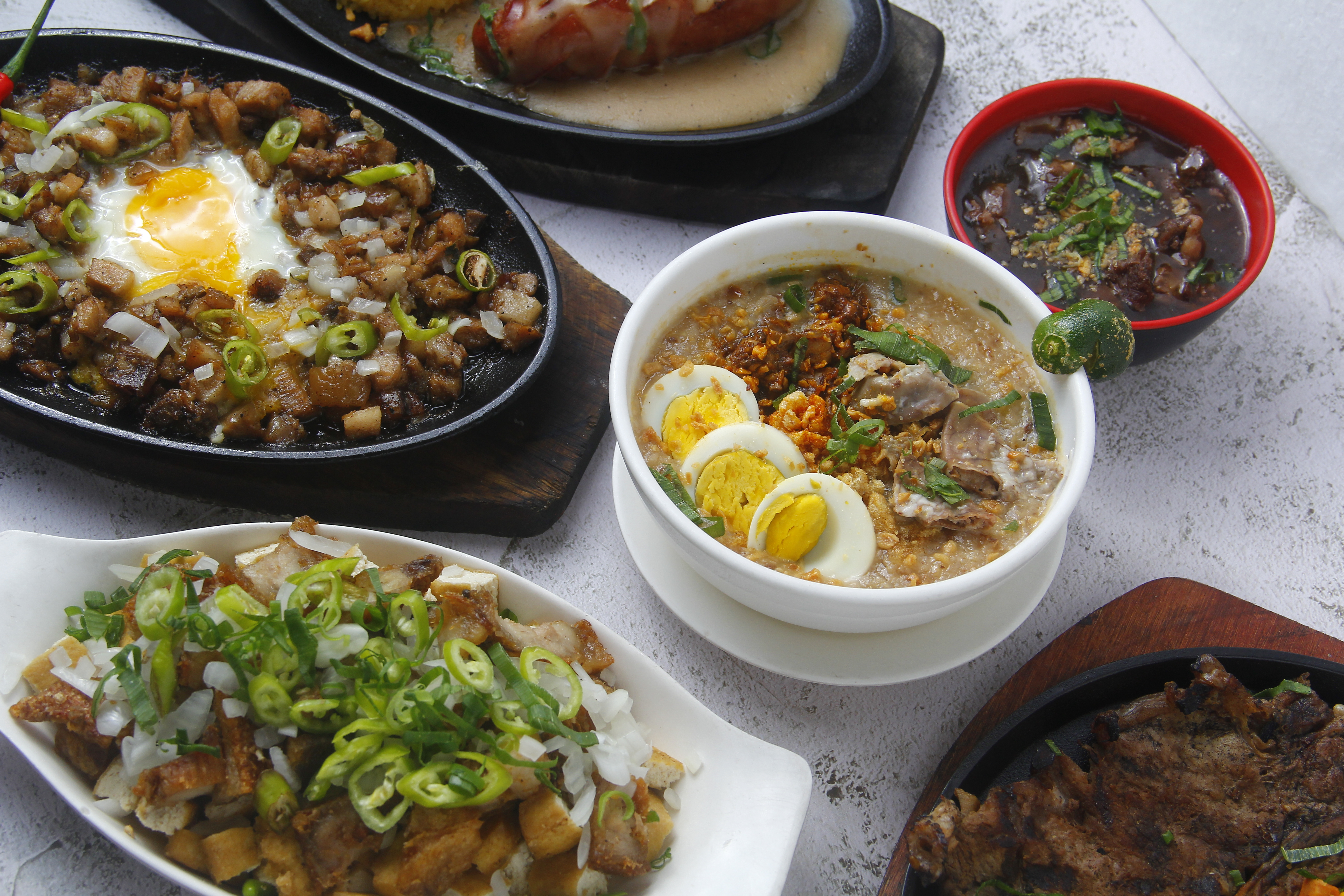 Assortment of Filipino Dishes on Table