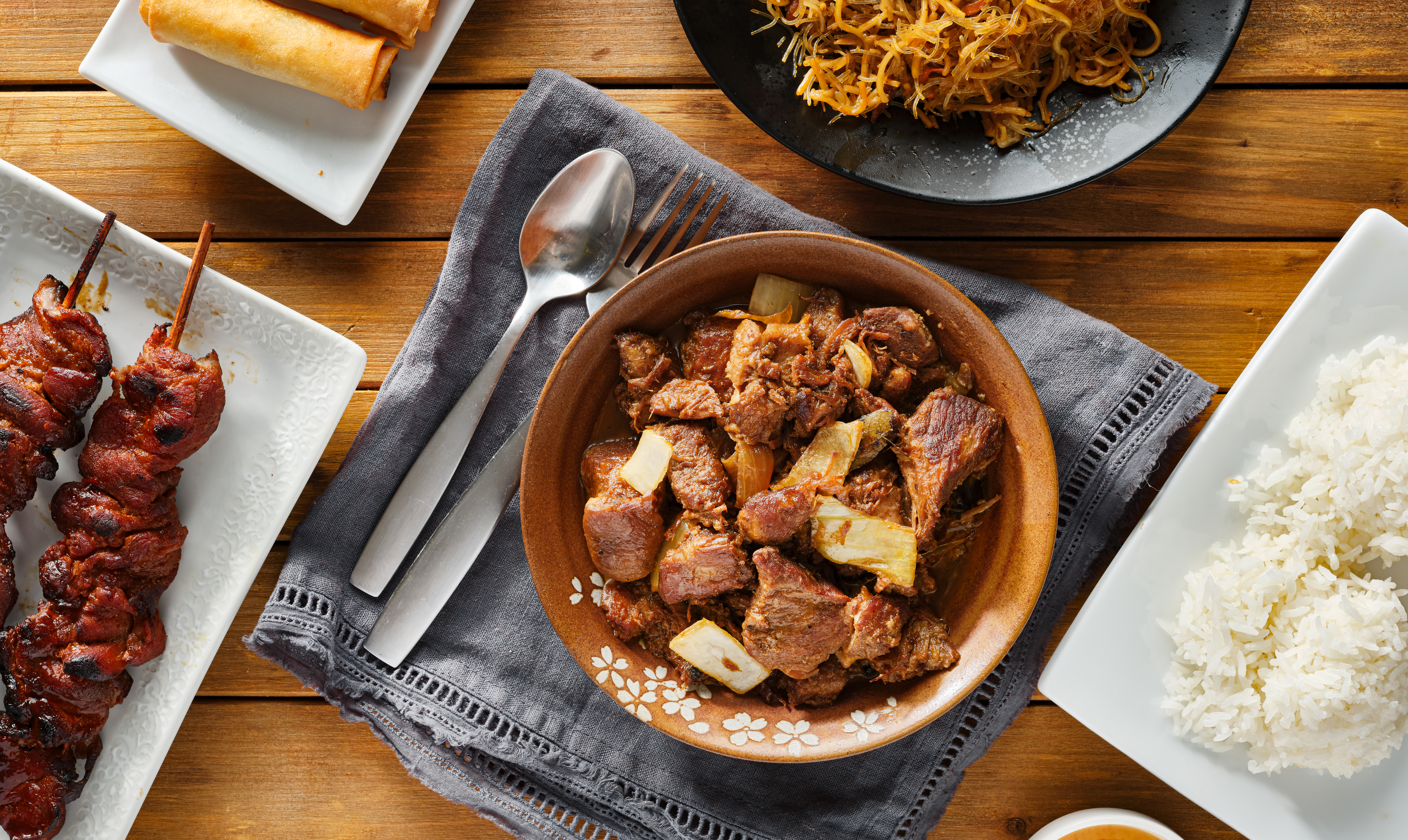 Overhead view of Filipino Cuisine with Rice and Skewers