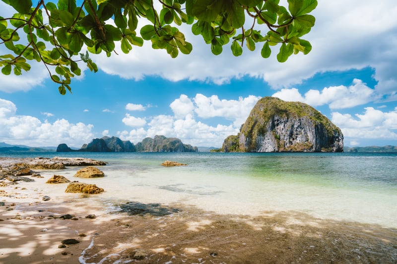 El Nido, Palawan, Philippines. Leaves framed picture of Pinagbuyutan island and beautiful tropical