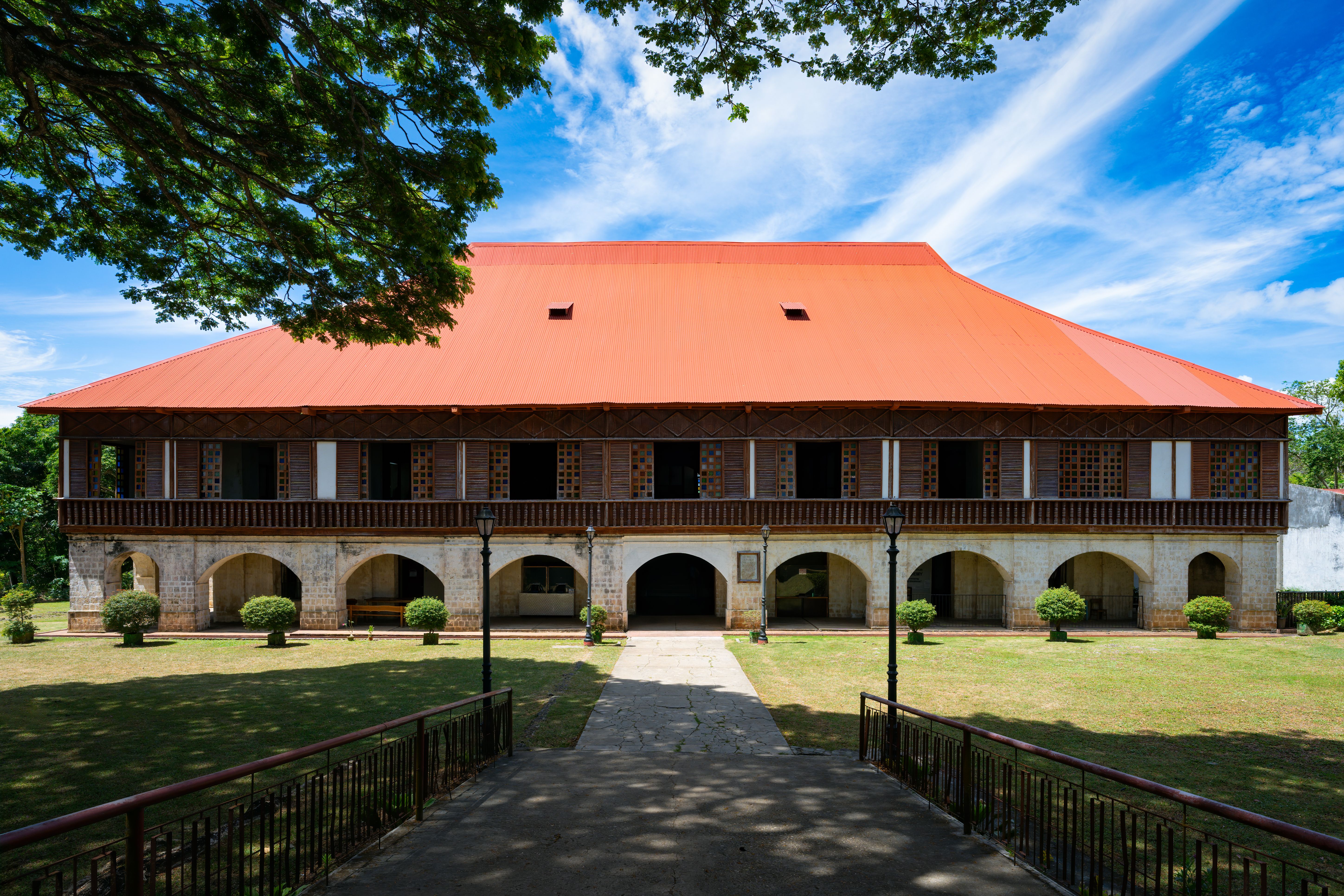 Image depicts a tranquil courtyard of Lazi Convent in Siquijor, Philippines
