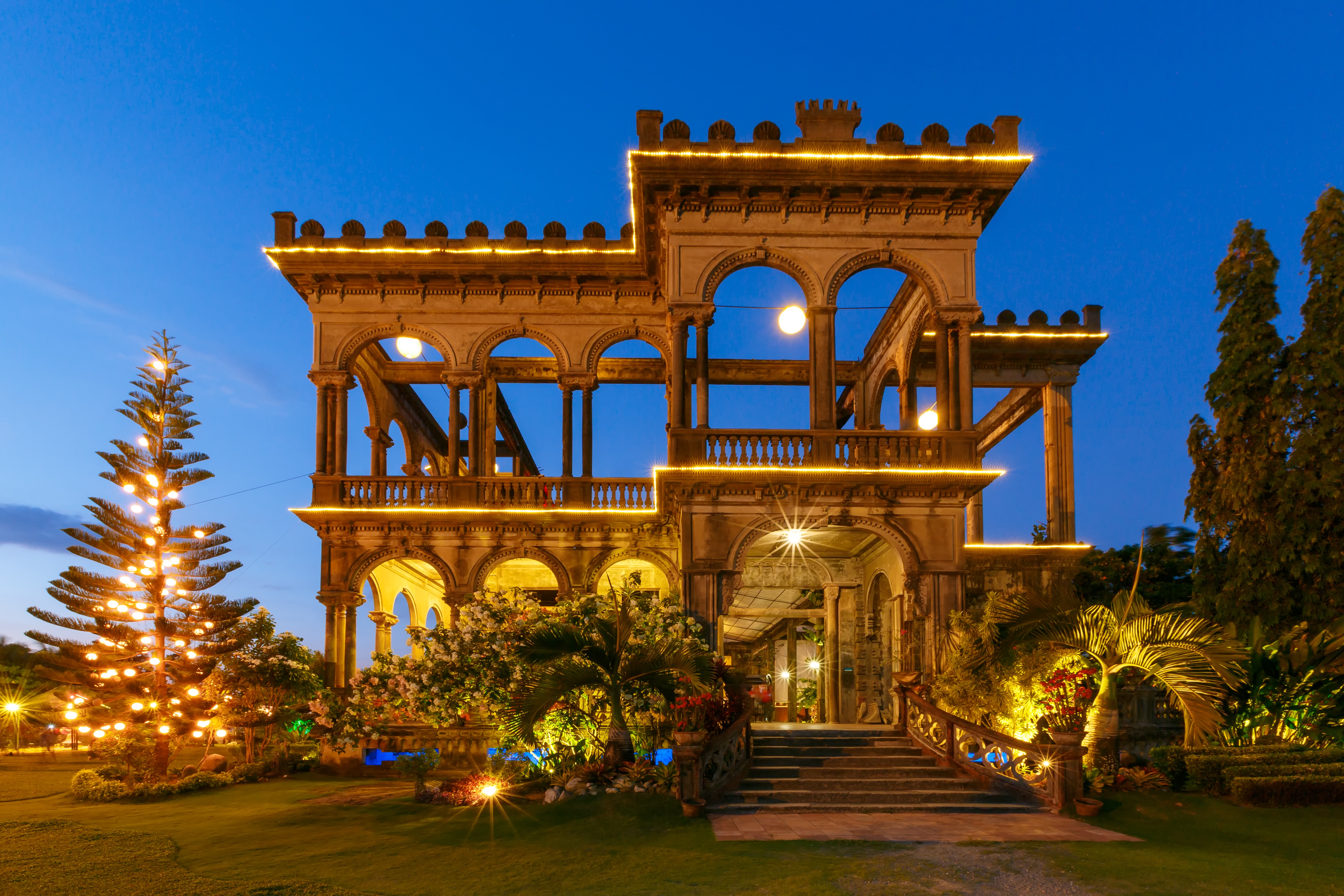 Ruins in Talisay, the Philippines with the switched-on lights captured during the evening