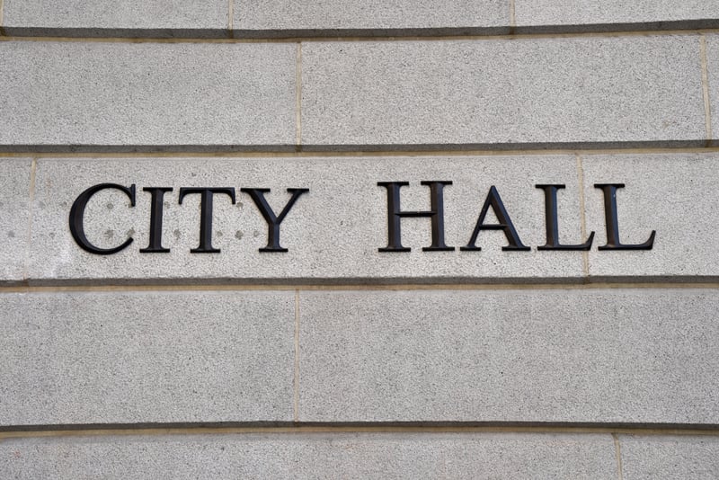 City Hall Sign On The Side Of A BuildingNaturesCharm