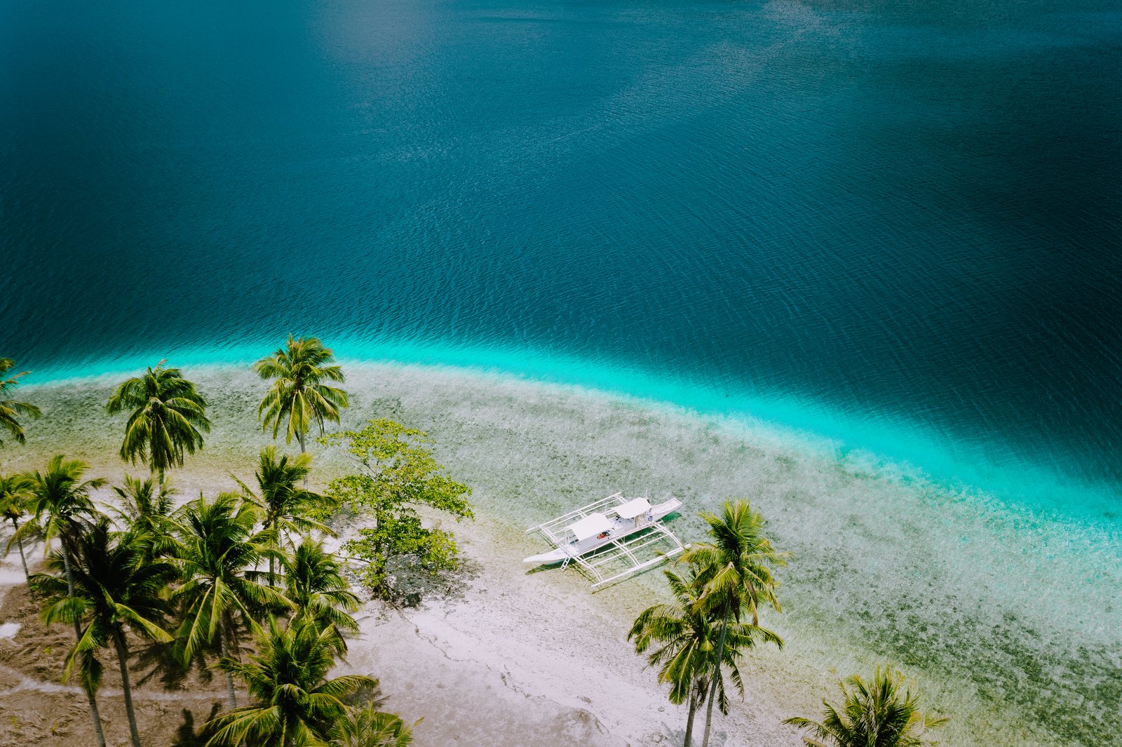 El Nido, Palawan, Philippines. Aerial drone view of tourist island hopping boats moored at tropical