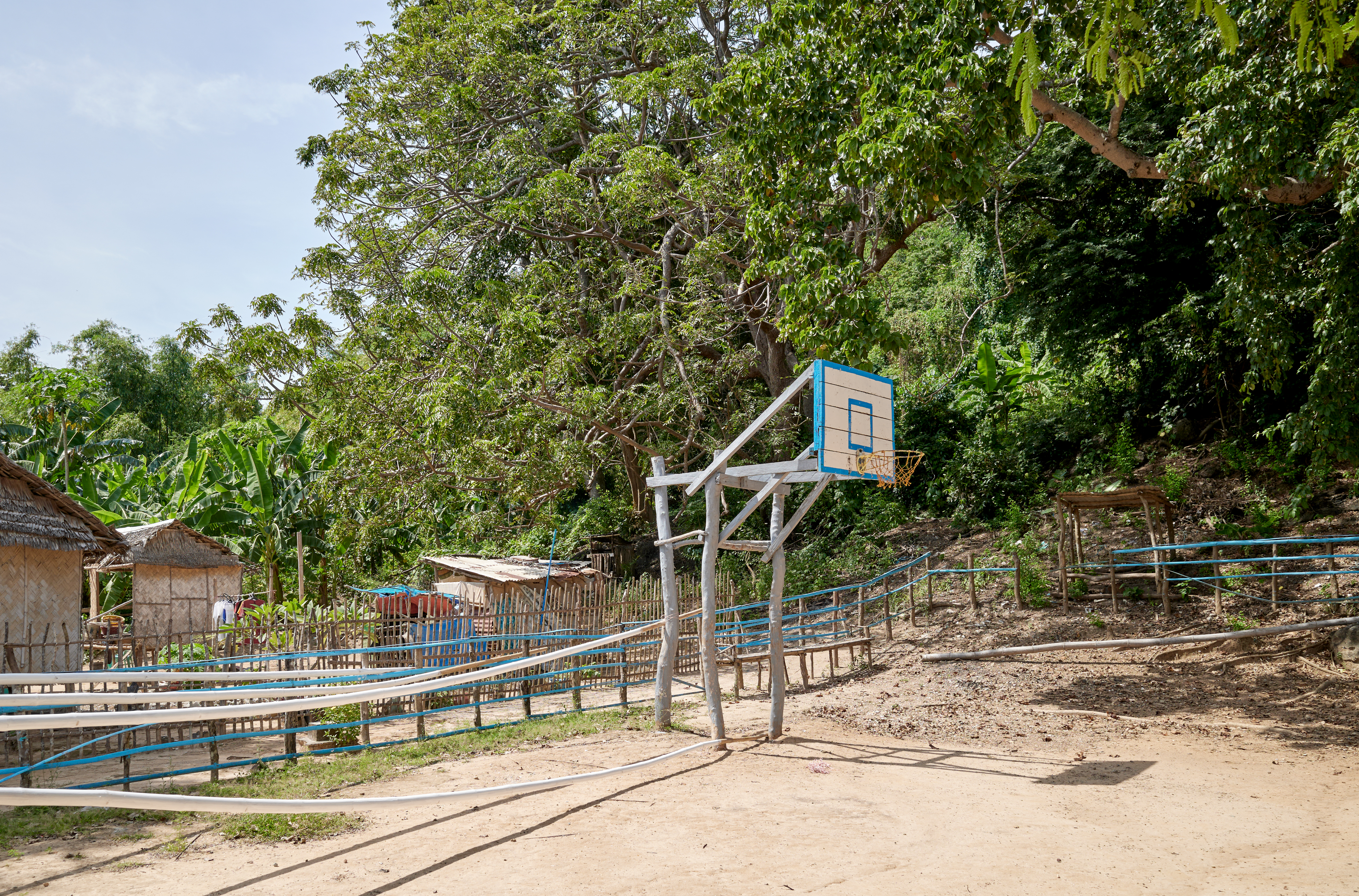 A basketball court in the sand on a small island in the Philippines.