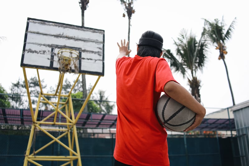 Adult Playing Basketball on an Outdoor CourtGarakta-Studio