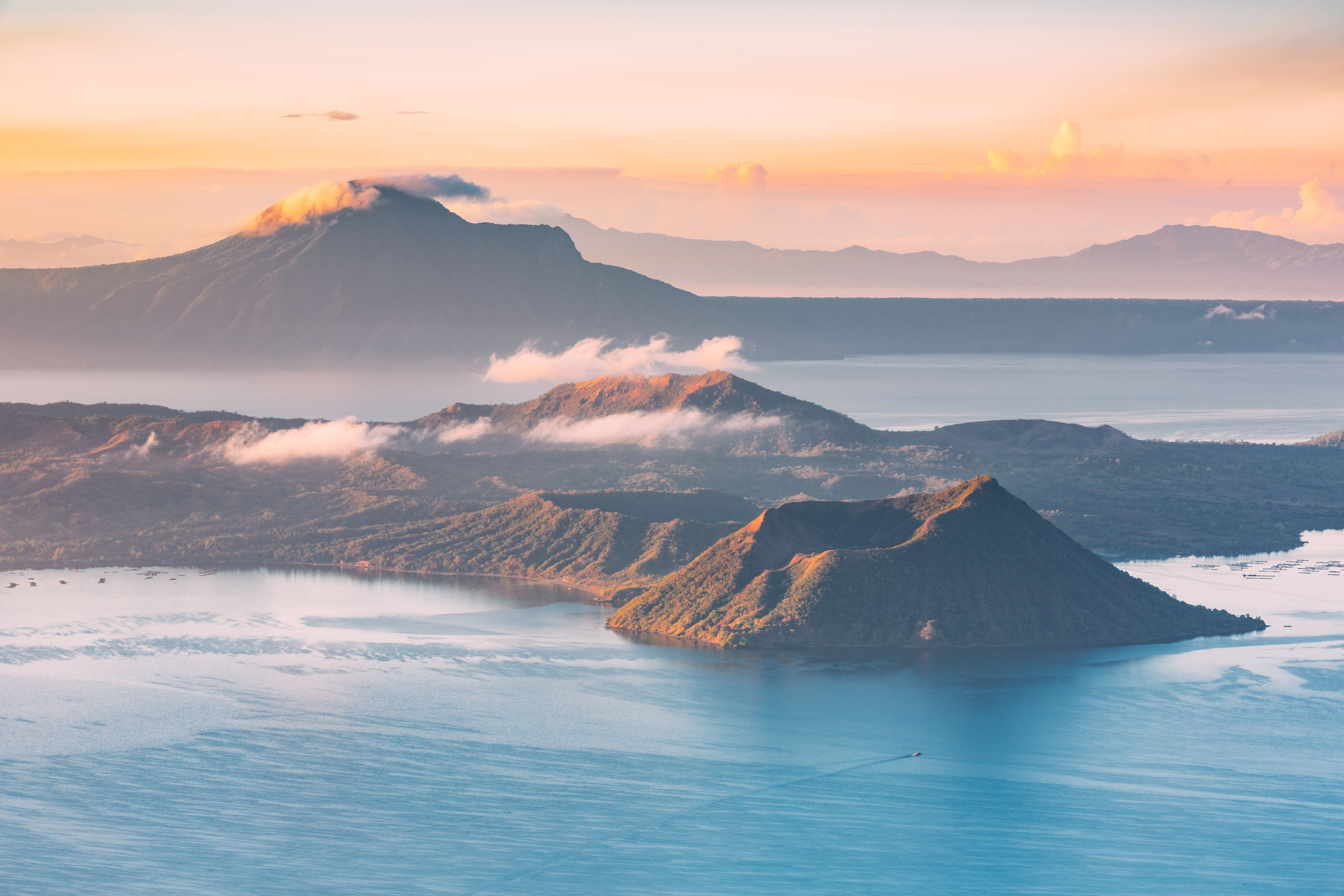 Landscape view of Taal Volcano in the Philippines with sunset in the background