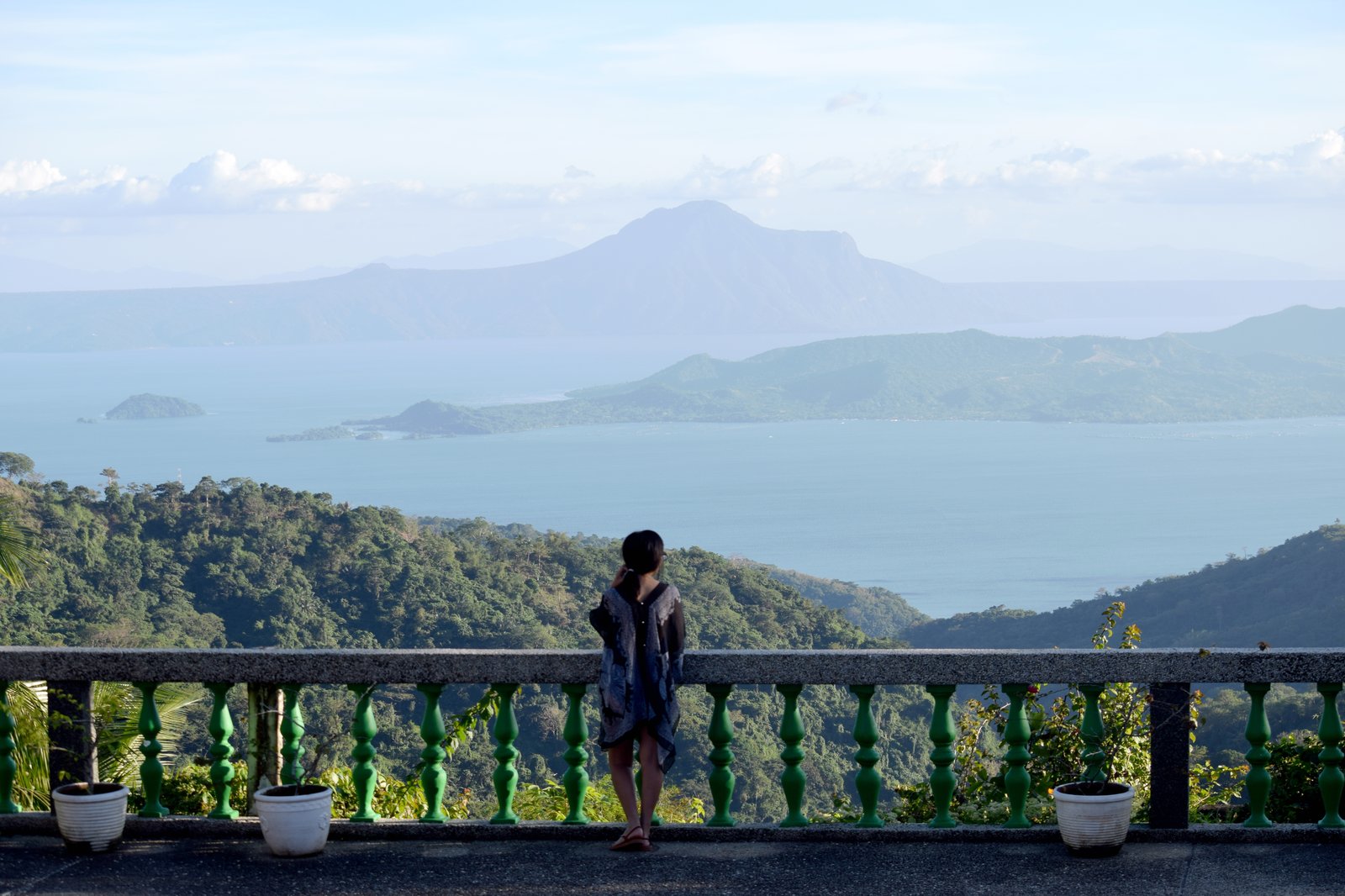 Woman enjoying the view of Taal volcano in the Philippines.