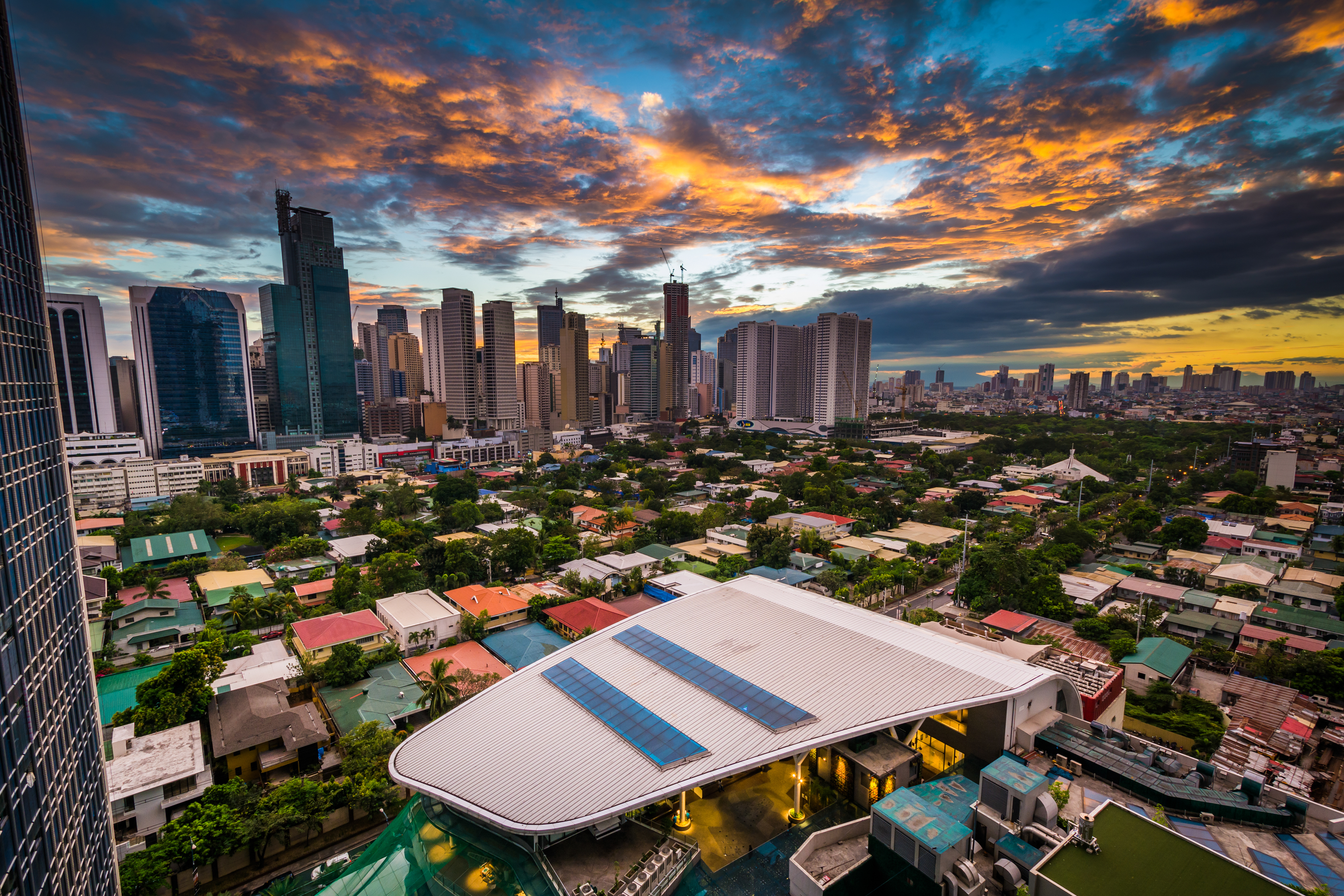 View Of The Skyline Of Makati At Sunset, In Metro Manila, The Philippines.