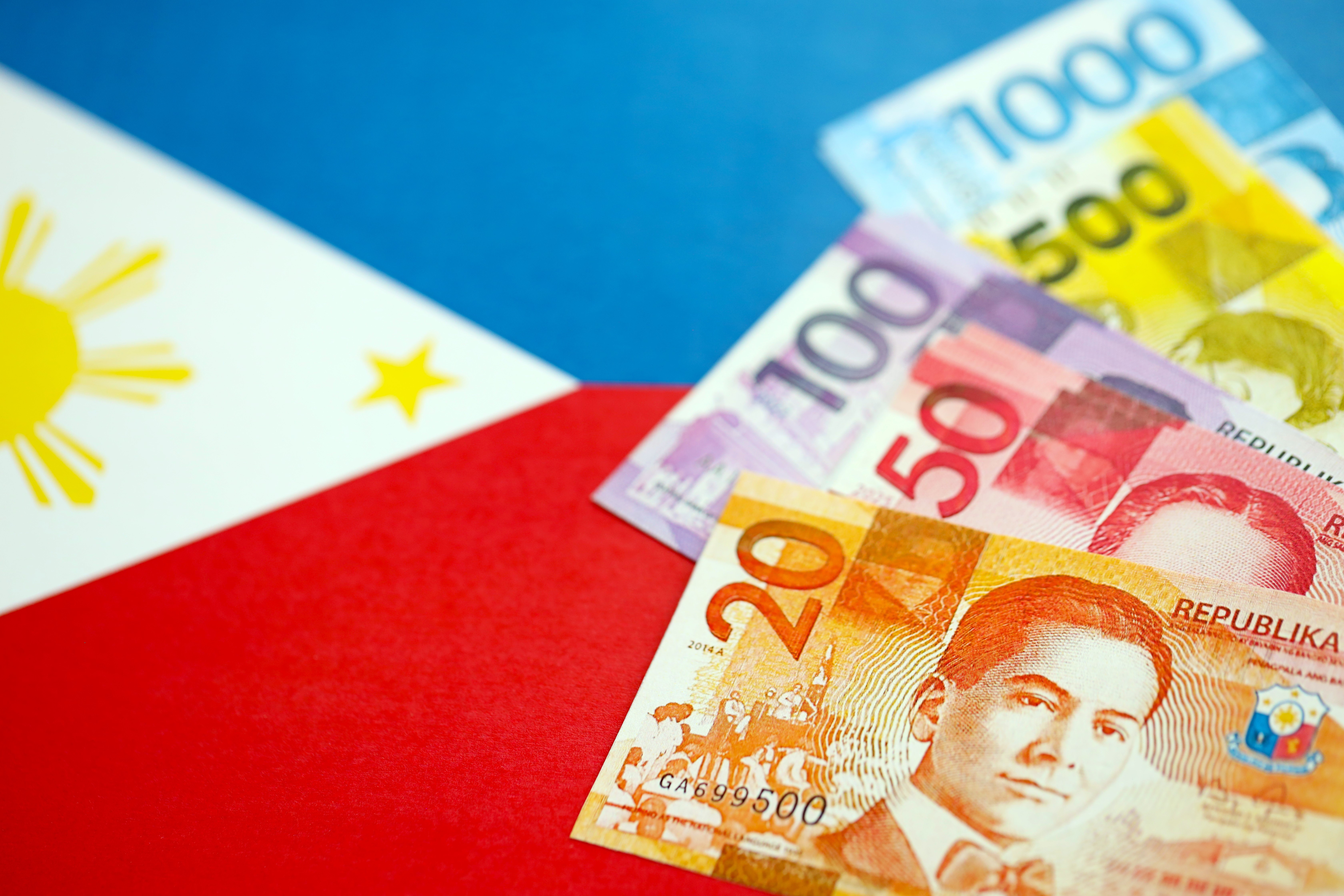 Philippine Currency Close Up with Flag Background