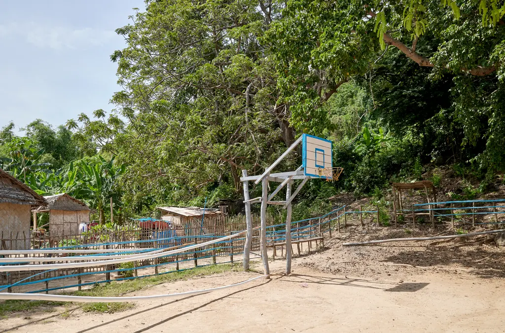 A basketball court in the sand on a small island in the Philippines.