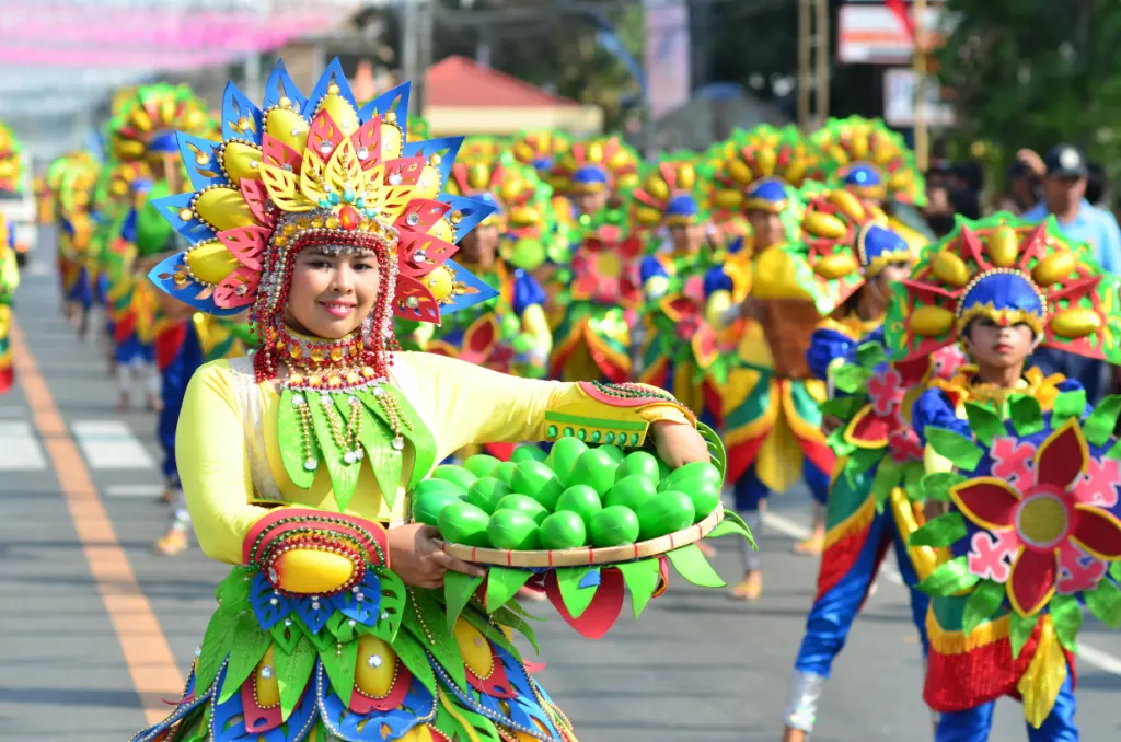 Colorful costumes and smiles at the Dinamulag Mango Festival parade in Zambales, Philippines.