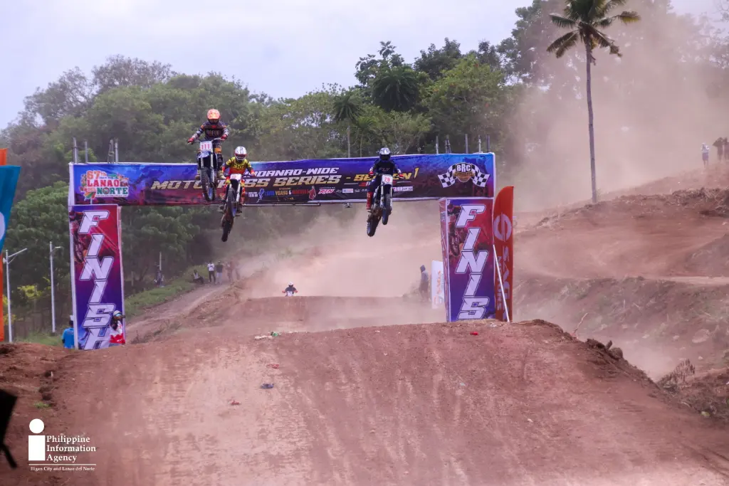 Three riders clear a jump as they approach the finish line during the Mindanao-wide Motocross Challenge at the Mindanao Civic Center Race Track in Tubod, Lanao del Norte, held as part of the 67th Araw ng Lanao del Norte celebration. (Photo: ADD/PIA-10/Lanao del Norte) _Airborne Finish.